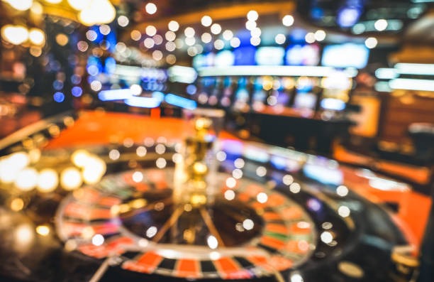 Jurassic Kingdom live studio with dinosaur-themed slot reels and professional croupier